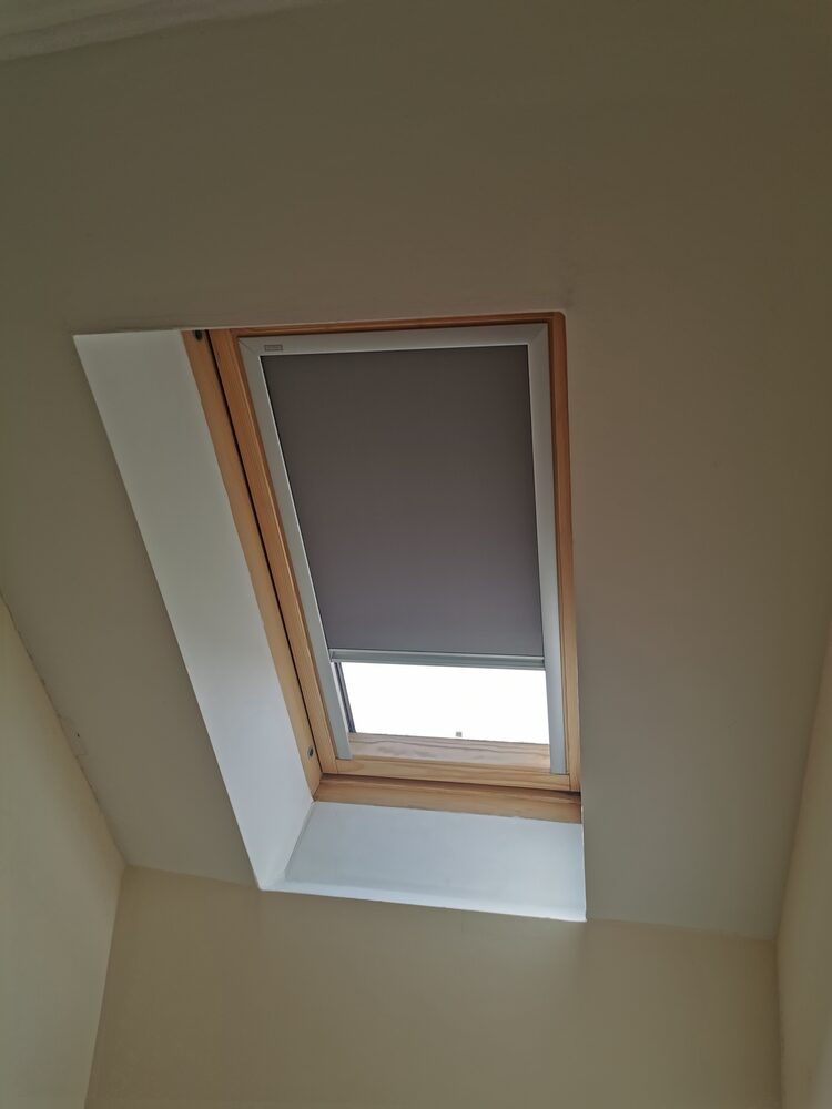 Blockout blind fitted to a Velux roof window in a loft conversion